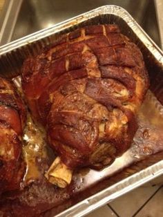 two cooked meats sitting on top of a metal pan