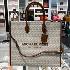 Michael Kors Mirella Large Signature Mk Tote Bag (Vanilla Mk) 35f2g7zt3b New With The Tag Authentic 100 % Polyester Imported Polyester Lining Open Closure Gold-Tone Hardware 15.75”W X 14”H X 7.75”D Handle Drop: 5.25” Adjustable Strap: 20.5”-24.25” Interior Details: Back Zip Pocket, 2 Front Slip Pockets Lining: 100% Polyester Details Tote Bag Logo Pvc Leather Gold-Tone Hardware 15.75”W X 14�”H X 7.75”D Handle Drop: 5.25” Adjustable Strap: 20.5”-24.25” Interior Details: Back Zip Pocket, 2 Front Sli Mk Tote Bag, Bag Logo, Bags Logo, Handbags Michael Kors, Bago, Michael Kors Bag, Interior Details, Womens Tote Bags, Zip Pockets