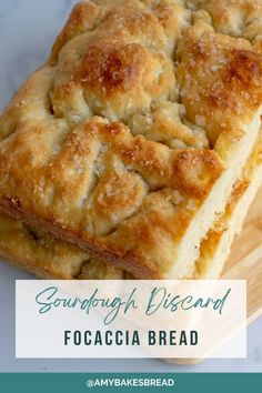 two squares of bread sitting on top of a cutting board with the words sourdough vissand focaccia bread