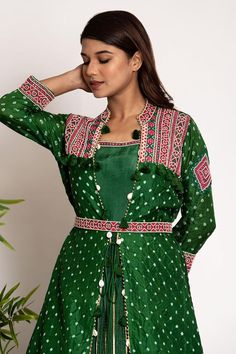 Green silk jacket with pearl embellished detail on bandhani pattern base. Comes with can can attached padded anarkali and belt
Components: 3
Pattern: Embroidered
Type Of Work: Bandhani, Pearl
Neckline: Jacket: Mandarin Collar
Sleeve Type: Jacket: Three quarter
Fabric: Silk
Color: Green
Other Details: 
Attached lining
Length: Anarkali: 58 inches
Disclaimer: These are made to order designer styles, hence expect a slight variation from the image displayed
Occasion: Sangeet,Mehendi and Haldi - Aza F Bandhani Jacket, Bandhani Pattern, Silk Jacket, Fabric Silk, Jacket Pattern, Green Silk, Embroidered Silk, Mandarin Collar, Set For Women