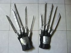 there are several knives in the hands of each other on the tile floor, and one is broken