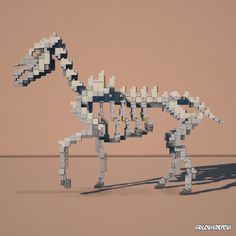 a horse made out of legos on a table with a pink wall in the background