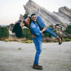 a man holding a woman on his back