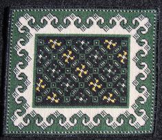 a green and white square with yellow flowers on it's side, in the middle of a black background