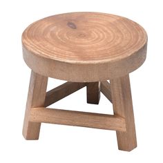 a small wooden stool sitting on top of a white background