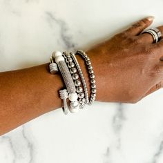 Add extra dazzle to your outfit with this gorgeous stack of bracelets. With a mix of delicate and bold pieces, sparkly rhinestones and glimmering metallics, the Annabella bracelet stack has everything you need to dress up any look. This bracelet stack includes: - Terri stainless steel and rhinestone cuff bangle - Tanisha howlite beaded bracelet with rhinestone bar - 2 Nakia stainless steel beaded bracelets (6mm and 8mm) - Nyoki stainless steel bracelet This bracelet stack will fit wrists up to 7 Amine Girl, Stack Of Bracelets, Horseshoe Bracelet, Weekly Workouts, Long Bracelet, Stacked Earrings, Heart Hoop Earrings, Mom Stuff, Stackable Bracelets