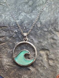 Beautiful wave pendant in dichroic glass set in stainless steel. Comes with a chain Ocean-inspired White Pendant Necklace, Gold Open Heart Necklace, Ocean-inspired Sterling Silver Necklaces, Nickel-free Ocean-inspired Pendant Jewelry, Silver Ocean-inspired Pendant Jewelry, Ocean-inspired Blue Pendant Necklace, Ocean Pendant, Triquetra Necklace, Wave Pendant