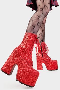 a woman wearing red glitter boots and stockings