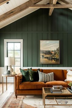 a living room filled with furniture and green walls