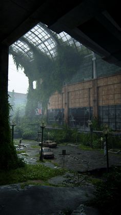 an abandoned building with lots of windows and plants growing out of it's roof