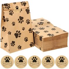 a brown paper bag with black dog paw prints on it