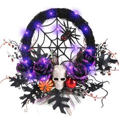 a white mask with purple lights and flowers in front of a black net circle decoration