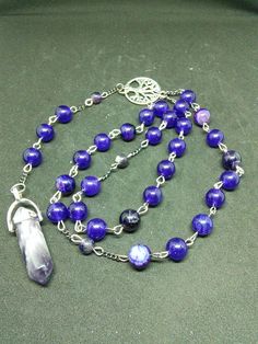 This is a beautiful re-imagined rosary based on the classic Catholic rosary. The beads are amethyst. There are three decades of nine beads each. The center is a tree of life, and I have capped it off with a amethyst pendent which can double as a spirit guide pendulum. With this rosary I'm including a simple chant which has resonated with me, but feel free to use your own! Pagan/witch prayer chant: Knot one, the work's begun. Knot two, my aim is true. Knot three, it will be. Knot four, power's st Spiritual Gemstone Beads Rosary, Spiritual Rosary With 8mm Beads, Spiritual Rosary With 8mm Beads For Healing, Spiritual Rosary Bracelet With Round Beads For Healing, Spiritual Healing Rosary Bracelet With Round Beads, Spiritual Beaded Rosary For Jewelry Making, Spiritual Rosary Bracelet With Natural Stones For Healing, Bohemian Rosary Bracelet With 8mm Beads For Meditation, Bohemian Beaded Rosary For Healing