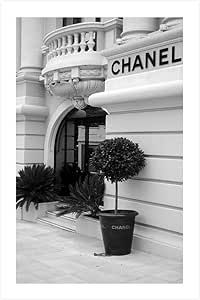 a black and white photo of a chandelier on the side of a building