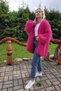 "Soft cozy warm mohair oversized cardigan, mohair cardigan, knitted cardigan, handknitted cardigan, fluffy cardigan, woolen cardigan, mohair pink cardigan, fuchsia mohair cardigan, fuchsia woolen cardigan. Soft, warm wool cardigan, chunky knit and trendy fuchsia color will not leave you indifferent. Pairs well with jeans and light outfits. It is possible to manufacture the same cardigan in any size, as well as in any other color that is in the palette in the photos. The term of production is 5-7 Cheap Chic Pink Cardigan, Cheap Pink Cardigan For Layering, Red And Pink Cardigan Outfit, Luxury Pink Cardigan For Fall, Cheap Stretch Pink Cardigan, Pink Mohair Outerwear For Fall, Cheap Pink Knitted Outerwear, Handmade Pink Cardigan For Fall, Fuschia Cardigan Outfit