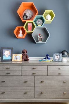 a dresser with several hexagonal shelves on it