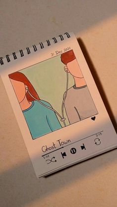 a drawing of a man and woman on a notebook