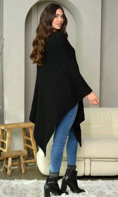 Enhance your wardrobe with our luxurious 'WOMEN'S RIBBED LONG PONCHO SWEATER', available in sizes Small to Large. Adorned with a ribbed pattern, this poncho exudes elegance and sophistication. Choose from our three color options - Mauve, Black, or Cream - to add a touch of beauty to any outfit. Whether you're heading out for a casual day or a glamorous evening, this poncho is the perfect accessory. Don't miss out on the chance to elevate your style and make a statement. Model is wearing size Sma Winter Long Sleeve Poncho For Layering, Long Sleeve Poncho For Cold Weather In Fall, Fall Long Sleeve Poncho, Long Winter Poncho, Long Poncho, Cute Boots, Poncho Sweater, Three Color, Sweater Weather