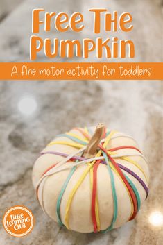 a white pumpkin with colorful ribbons on it and the words free the pumpkin above it