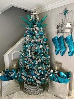 a christmas tree with blue and silver decorations