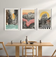 three art prints hanging on the wall above a dining room table with two vases