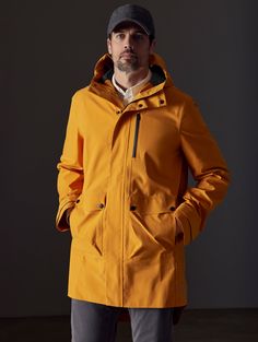 Front body view of man wearing Anders Rain Jacket in Midas Orange from AETHER Apparel. Modern Waterproof Raincoat For Workwear, Modern Nylon Outerwear For Rainy Weather, Modern Waterproof Outerwear For Outdoor, Modern Waterproof Nylon Outerwear, Functional Weatherproof Windbreaker For Work, Waterproof Nylon Outerwear For Work, Life Of Adventure, Mens Outerwear, We Wear