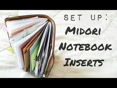 an open notebook with the words set up midori notebook inserts