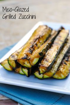 grilled zucchini on a plate with sauce