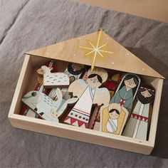 a wooden nativity set in a box