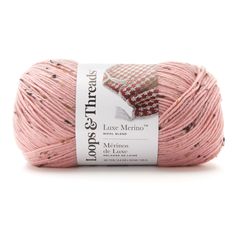 a ball of pink yarn on a white background