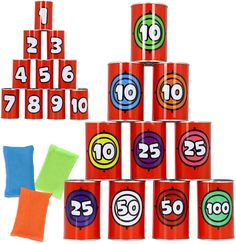 a stack of red cups with numbers on them next to colored markers and cloths