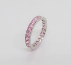 Vintage Sterling Silver Princess Pink Sapphire Band Ring ....Marked 925....Total of weights 2.2grams...Size 8...Measure of Band 3.6MM...It's in very good condition. Classic Pink Sapphire Promise Ring, Silver Rings With Pink Sapphire Birthstone, Pink Sapphire Silver Ring, Silver Pink Sapphire Ring With Birthstone Details, Silver Pink Sapphire Rings For Gift, Pink Sapphire Band, Sapphire Band, Pink Sapphire, Promise Rings