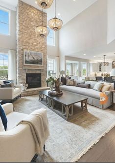 a living room filled with furniture and a fire place in the middle of a room