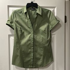 Ny&Co. Short Sleeve (Small) Women’s Button Down Dress Shirt. Olive/Army Green Color. New With Tags. No Imperfections. Fitted Green Office Shirt, Fitted Green Blouse With Button Closure, Green Short Sleeve Office Blouse, Short Sleeve Business Casual Blouse With Buttons, Green Short Sleeve Blouse For Office, Fitted Green Shirt For Work, Fitted Shirt With Snap Buttons, Green Fitted Button-up Shirt, Green Button Closure Top For Business Casual