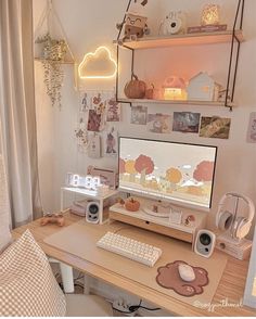 a desk with a computer and speakers on it