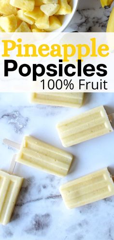 pineapple popsicles on a marble counter top with bananas and apples in the background