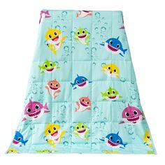 a baby blanket with sharks on it and bubbles in the water around them, as well as an image of a shark