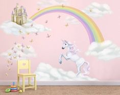 a child's room with a pink wall and unicorn mural