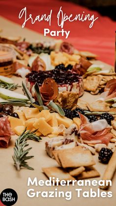 a table topped with lots of different types of cheese and crackers on top of it