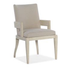 the arm chair is made from wood and has a beige upholstered fabric seat