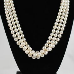 This sophisticated triple strand cultured pearl necklace exudes timeless elegance, featuring three rows of lustrous pearls that gracefully drape around the neck. The piece is accentuated by a stunning 3ct diamond pave onyx clasp, set in 18K gold, adding a touch of luxurious sparkle and dramatic contrast. Combining classic pearls with a bold, modern clasp, this necklace is the epitome of refined and versatile style. Metal Type: 18K Yellow Gold (Tested) Weight: 113.4G Length: 20" Width: 21.59mm  T Cultured Pearl Necklace, Multi Strand Necklace, Fine Jewellery Necklace, Strand Necklace, Cultured Pearls, Multi Strand, Versatile Style, Pave Diamonds, Types Of Metal