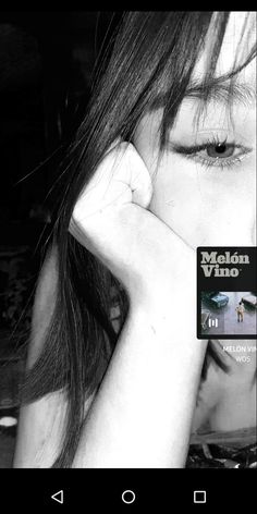 black and white photo of a woman holding her hand to her face with the words melon vino on it