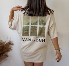 "This is the Unisex-Style Van Gogh Olive Orchard Tee. It is a super cool, heavy cotton tee that is blank on the front and has Van Gogh's painting, \"The Olive Orchard,\" on the back. This classic T is made with cotton, sometimes polyblend (depending on the color) and has no uncomfortable side seams. This shirt would be great for people o fall genders! If you are a classical art lover who wants a unique way to rep your favorite artist, this is the tee for you! This design is an original, created Artistic Short Sleeve Relaxed Fit Shirt, Artistic Short Sleeve Relaxed Shirt, Artsy Relaxed Fit Tops With Custom Artwork, Artistic Short Sleeve Shirt With Custom Artwork, Artistic Short Sleeve Tops With Custom Artwork, Artistic Custom Print Top With Relaxed Fit, Artistic Relaxed Fit Top With Custom Print, Artsy Relaxed Fit Top With Custom Print, Artistic Relaxed Fit Shirt With Screen Print