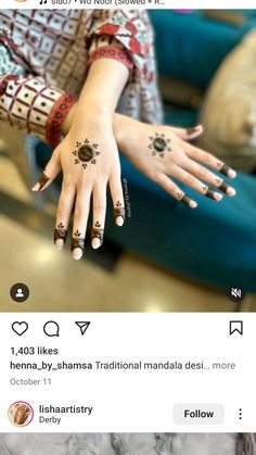 a woman's hand with henna on it