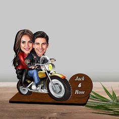 a wooden caricature of a couple on a motorcycle