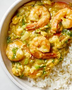 a white bowl filled with rice and shrimp