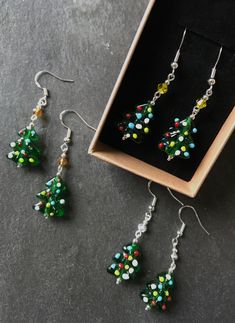 Quirky handmade Christmas tree earrings, made from glass tree shaped beads, matched with a choice of three upcycled vintage crystal 'stars'. Sterling silver earwires. I never repeat a design exactly, so you can be sure of an original gift or treat. Handmade in Kidwelly, Wales. Silver Gift Wrap, Glass Tree, Handmade Christmas Tree, Tree Earrings, Christmas Tree Earrings, Earrings Christmas, Earring Tree, Crystal Stars, Tree Shapes