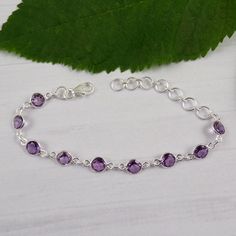 "Amethysy Bracelet, Amethyst Bracelets, Sterling Silver Bracelet, February Birthstone, Dainty Bracelet, Bezel Bracelet, Lobster Claw, M111127 Main Color:  Amethyst Size: Adjustable (6.25\"+ 2.25\" inch with  Extender) Weight: 6.2 gram  Stone size (can vary as per availability) : 6mm Round        Item code: M111127 You can use it your self or Gift it to someone. It is an ideal gift which everyone would love to get. If you want extra small or extra large let me know. We will make it specially for Bezel Bracelet, Dainty Bracelet, Pretty Bracelets, Amethyst Bracelet, February Birthstone, Moonstone Necklace, Dainty Bracelets, Personalized Bracelets, February Birth Stone