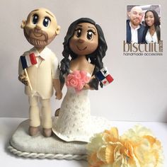 a wedding cake topper with a bride and groom