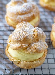 powdered sugar covered pastries on a cooling rack